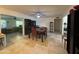 Dining area with a dark wood table and four chairs. Kitchen is visible at 4624 E Emerald Ave, Mesa, AZ 85206