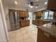 Kitchen with wood cabinets, granite countertops, and stainless steel appliances at 4624 E Emerald Ave, Mesa, AZ 85206