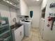 Bright laundry room with washer, dryer, and utility sink at 4624 E Emerald Ave, Mesa, AZ 85206