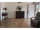 Living room with wood-look floors and a large window at 4624 E Emerald Ave, Mesa, AZ 85206