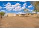 Large backyard with gravel, covered patio, and storage shed at 4809 W Sandra Ter, Glendale, AZ 85306