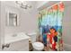 Bathroom with shower/tub, vanity, and patterned shower curtain at 4809 W Sandra Ter, Glendale, AZ 85306