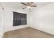 Simple bedroom with carpet, ceiling fan, and window coverings at 4809 W Sandra Ter, Glendale, AZ 85306