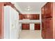 Kitchen with dark wood cabinets and granite countertops at 4809 W Sandra Ter, Glendale, AZ 85306