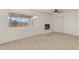 Bright living room with tile flooring and fireplace at 4809 W Sandra Ter, Glendale, AZ 85306