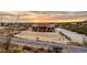 Aerial view of a single-story house with desert landscaping and a large yard at 5063 E Reavis St, Apache Junction, AZ 85119