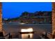 Evening view of backyard fire pit and mountains at 5063 E Reavis St, Apache Junction, AZ 85119