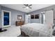 Bedroom with dresser, large bed, and sliding barn door at 5063 E Reavis St, Apache Junction, AZ 85119