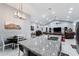 Granite kitchen island with breakfast bar, modern lighting and mountain views at 5063 E Reavis St, Apache Junction, AZ 85119