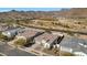 Aerial view of a residential area with houses and desert landscape at 5252 N 206Th Dr, Buckeye, AZ 85396