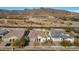 Community overview showcasing multiple homes with mountain views at 5252 N 206Th Dr, Buckeye, AZ 85396