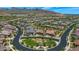 Aerial view of community with green spaces and homes at 5252 N 206Th Dr, Buckeye, AZ 85396