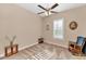 Bright bedroom with carpet flooring, window with shutters, and ceiling fan at 5252 N 206Th Dr, Buckeye, AZ 85396