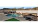 Relaxing pool area with hot tub and outdoor kitchen at 5252 N 206Th Dr, Buckeye, AZ 85396