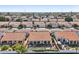 Aerial view of homes with pools and backyard features at 5582 W Aster Dr, Glendale, AZ 85304