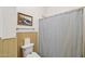 Simple bathroom with shower/tub combo and striped shower curtain at 5582 W Aster Dr, Glendale, AZ 85304