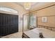 Bedroom with a canopy bed, ample natural light, and a dresser at 5582 W Aster Dr, Glendale, AZ 85304