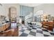 Elegant dining area with checkerboard floor and large window at 5582 W Aster Dr, Glendale, AZ 85304