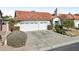 Two-car garage and well-maintained front yard at 5582 W Aster Dr, Glendale, AZ 85304