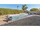 Inviting backyard pool with a water feature and lush landscaping at 5582 W Aster Dr, Glendale, AZ 85304