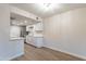 Bright dining area with wood-look flooring and kitchen access at 600 S Dobson Rd # 166, Mesa, AZ 85202