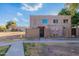 Front view of a two-story stucco building with gated entry at 600 S Dobson Rd # 166, Mesa, AZ 85202