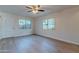 Bright living room with laminate flooring and ceiling fan at 600 S Dobson Rd # 166, Mesa, AZ 85202