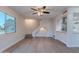 Living room with wood-look flooring, stairs and a ceiling fan at 600 S Dobson Rd # 166, Mesa, AZ 85202