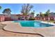 Relaxing kidney-shaped pool with a tiled deck at 600 S Dobson Rd # 166, Mesa, AZ 85202