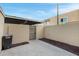 Small backyard with brick wall and gate access at 601 E Palo Verde Dr # 14A, Phoenix, AZ 85012