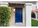 Front entry with a blue door and landscaping at 601 E Palo Verde Dr # 14A, Phoenix, AZ 85012