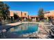 Community pool with lounge chairs and surrounding buildings at 601 E Palo Verde Dr # 14A, Phoenix, AZ 85012