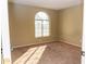 Bright bedroom with arched window and carpet at 7456 W Greer Ave, Peoria, AZ 85345