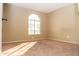 Well-lit bedroom featuring carpeted floor and large window at 7456 W Greer Ave, Peoria, AZ 85345