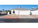 Single-story home with attached garage and desert landscaping at 7456 W Greer Ave, Peoria, AZ 85345