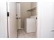 Small laundry room with washer, dryer, and storage at 7456 W Greer Ave, Peoria, AZ 85345