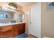 Bathroom with double vanity, large mirror, and shower at 7764 N 19Th Dr, Phoenix, AZ 85021