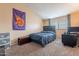 Bedroom with a bed, chair, and desk at 7764 N 19Th Dr, Phoenix, AZ 85021