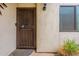 Front door with security screen and small plants at 7764 N 19Th Dr, Phoenix, AZ 85021