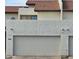 Attached garage with off-white door and security cameras at 7764 N 19Th Dr, Phoenix, AZ 85021