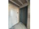 Condo building entry with two doors, one white, one dark green at 7777 E Main St # 215, Scottsdale, AZ 85251