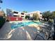 Community pool with lounge chairs and building view at 7777 E Main St # 215, Scottsdale, AZ 85251