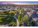 Aerial view of a community with houses, parks, and walking paths at 813 E Verde Blvd, Queen Creek, AZ 85140