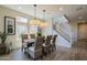 Dining room with four chairs and a view of the staircase at 813 E Verde Blvd, Queen Creek, AZ 85140