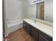 Clean and modern bathroom with a bathtub and updated vanity at 8148 W Atlantis Way, Phoenix, AZ 85043