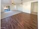 Open dining area with wood-look floors and view to living room at 8148 W Atlantis Way, Phoenix, AZ 85043