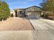 House exterior featuring a two-car garage and well-maintained landscaping at 8148 W Atlantis Way, Phoenix, AZ 85043