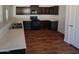 Modern kitchen with dark brown cabinets and stainless steel appliances at 8148 W Atlantis Way, Phoenix, AZ 85043