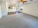 Spacious living room with carpeted floors and an open floor plan at 8148 W Atlantis Way, Phoenix, AZ 85043