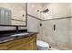 Elegant bathroom with a frameless shower and dark vanity at 850 E Del Rio St, Chandler, AZ 85225